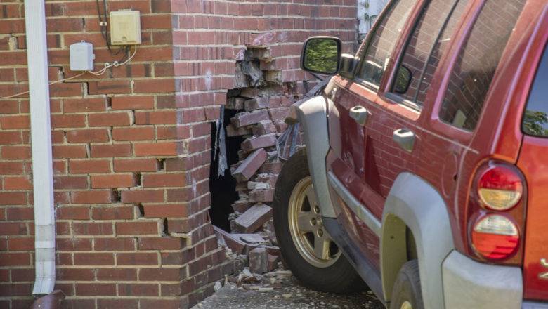 Driver Says Dog To Blame After Crashing Into House